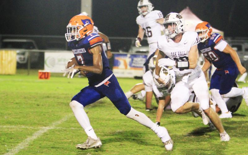 Branford receiver Ar’kayvion Jones runs past the Oak Hall defense last Friday. (PAUL BUCHANAN/Lake City Reporter)