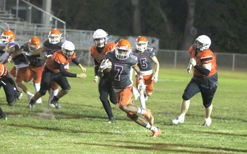 Branford receiver Ar'Kayvion Jones takes a handoff for a touchdown Friday night against Trenton. (MORGAN MCMULLEN/Lake City Reporter)