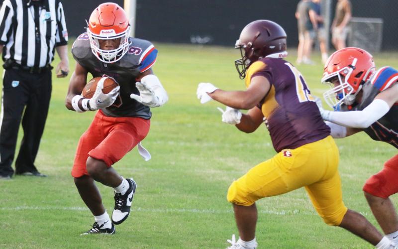 Branford receiver Maurice Vought runs up the field after a catch against Crescent City during their Preseason Jamboree on Aug. 16. (MORGAN MCMULLEN/Lake City Reporter)