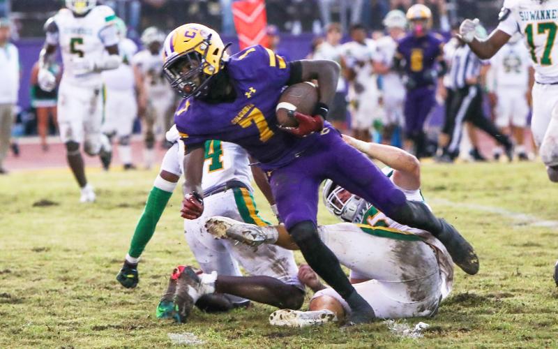 Columbia receiver Kyren Caldwell breaks through a tackle against Suwannee last Friday. (BRENT KUYKENDALL/Lake City Reporter)