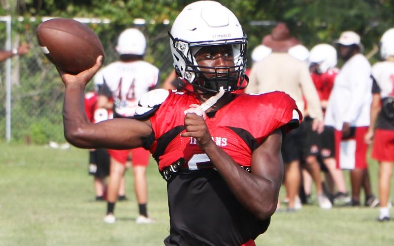 Fort White quarterback Jayden Jackson throws a pass during Thursday’s practice. (MORGAN MCMULLEN/Lake City Reporter)
