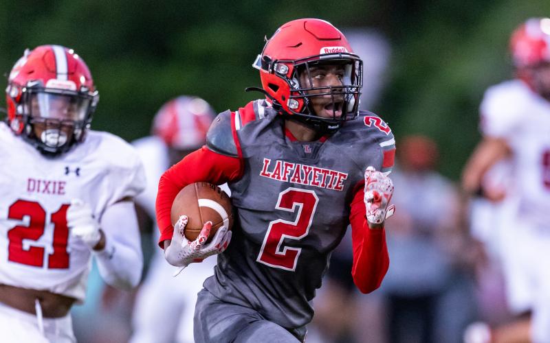 Lafayette receiver Jordan Murphy races to the end zone for a touchdown against Dixie County on Friday. (JACK HOWDESHELL/Lake City Reporter)