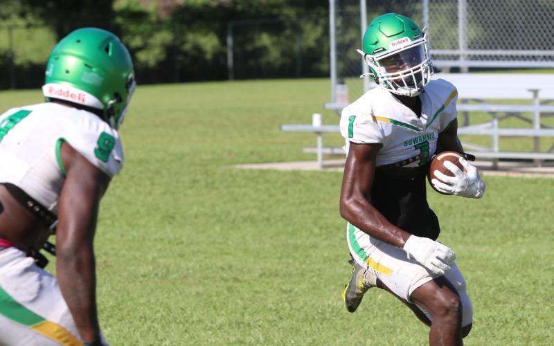 Suwannee receiver MJ Rossin turns up the field after catching a pass during Saturday’s practice. (JAMIE WACHTER/Lake City Reporter)