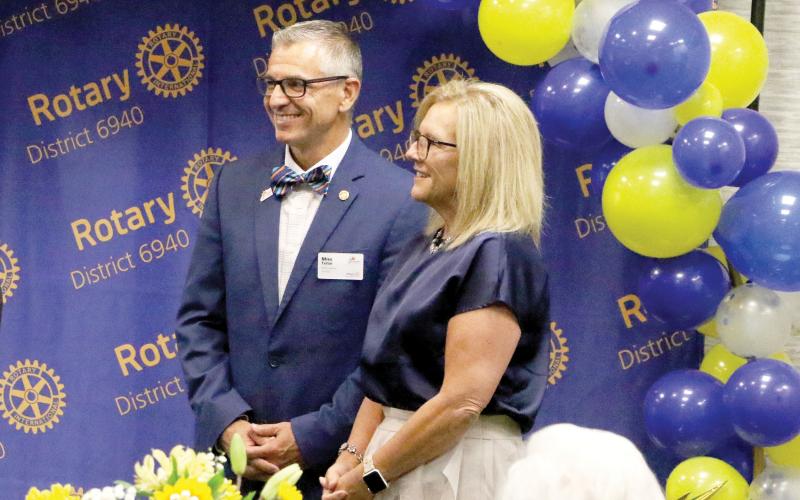 Mike Tatem is all smiles with his wife, Judy, when he was sworn in as the district governor for Rotary International District 6940 in June. Tatem hopes to help improve disaster response across the district during his term as governor. (MORGAN MCMULLEN/Lake City Reporter)