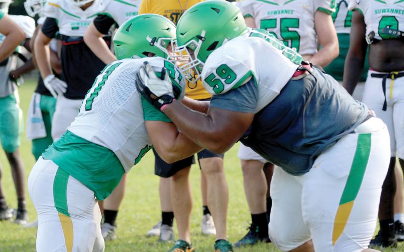 Suwannee offensive lineman Brody Bean and defensive lineman Will Brown perform a run-blocking drill during practice on Aug. 3. (JAMIE WACHTER/Lake City Reporter)