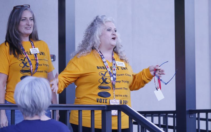 Tomi Brown, Columbia County’s supervisor of elections, addresses the crowd outside her office Tuesday night about the state’s website crash. (JAMIE WACHTER/Lake City Reporter)