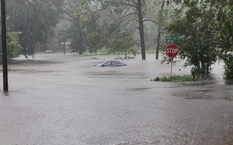 A car is submerged in flood waters along Ohio Avenue in Live Oak on Monday as Hurricane Debby passed through. (JASON WILKINSON/Lake City Reporter)