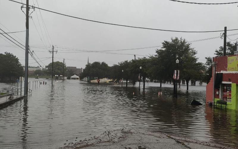 Flood waters from Hurricane Debby covered downtown Live Oak on Monday. (JASON WILKINSON/Lake City Reporter)