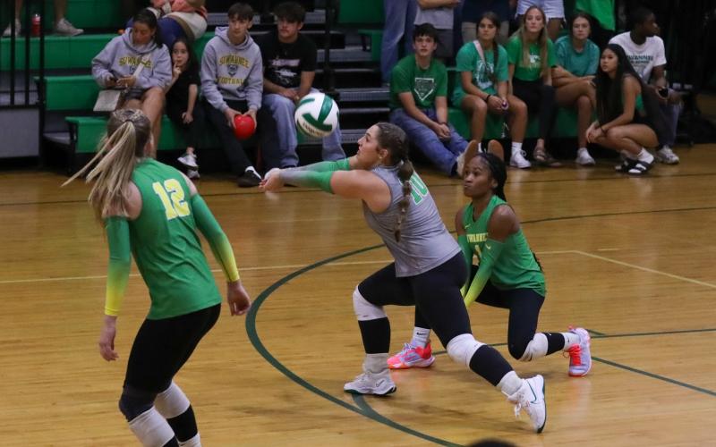 Suwannee libero CaLinn Daniel digs a shot against Columbia on Aug. 20. (BRENT KUYKENDALL/Lake City Reporter)