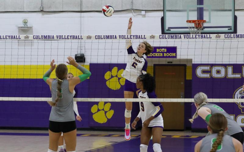 Columbia hitter Sinei Wood attempts returns a shot against Suwannee on Sept. 3. (BRENT KUYKENDALL/Lake City Reporter)