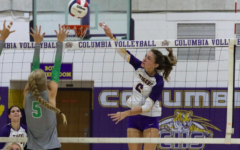 Columbia hitter Sinei Wood fires a shot over the arms of Suwannee's Brooke Fernald on Tuesday night. (BRENT KUYLENDALL/Lake City Reporter)