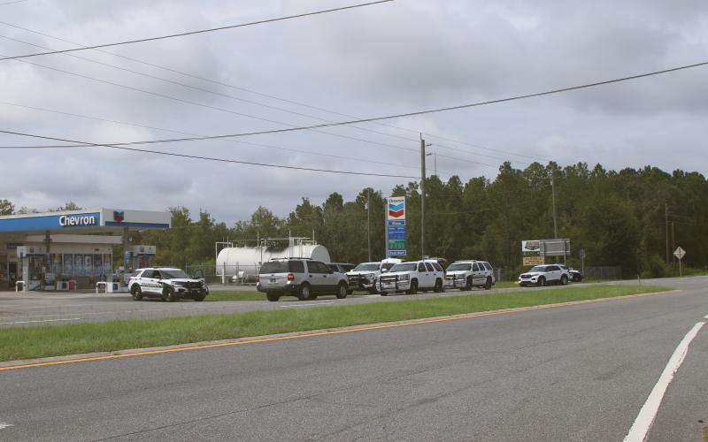 Columbia County Sheriff’s Office deputies set up operations near the intersection of Interstate 10 and U.S. Highway 441 on Monday afternoon while searching for a fugitive. (TONY BRITT/Lake City Reporter)