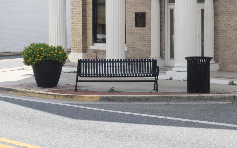 A city bench sits along N. Marion Avenue on Wednesday. Four similar benches were stolen Monday night from the city’s easements along Marion Avenue. (TONY BRITT/Lake City Reporter)