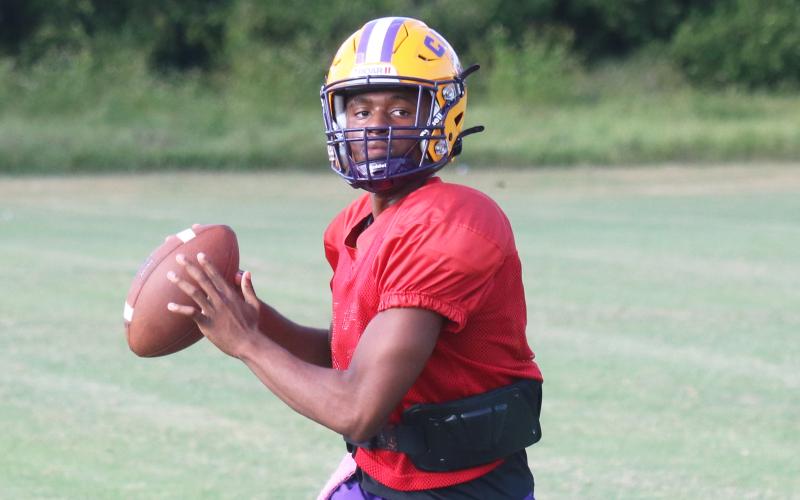 Columbia quarterback Xavier Collins drops back to pass during Tuesday’s practice. (JORDAN KROEGER/Lake City Reporter)