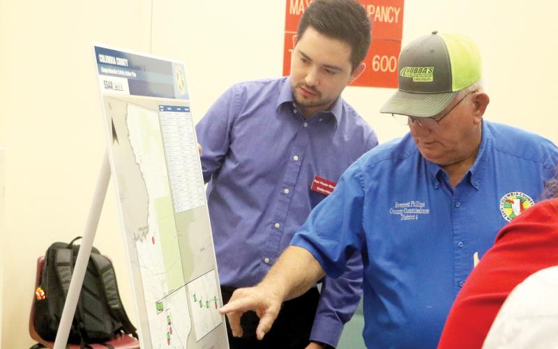 Columbia County Commissioner Everett Phillips (right) and Kimley-Horn’s Raul Pineda-Mendez look over a map of the Columbia County Comprehensive Safety Action Plan during an open house Thursday. (MORGAN MCMULLEN/Lake City Reporter)