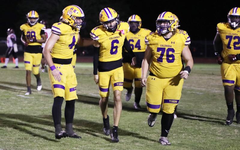 Columbia receiver Bynton Edge (6) celebrates alongside defensive end Ayden Phillips (4) and center Zackery Grimes (76) after one of his two touchdown catches against Hillsborough on Friday. (BRENT KUYKENDALL/Lake City Reporter)