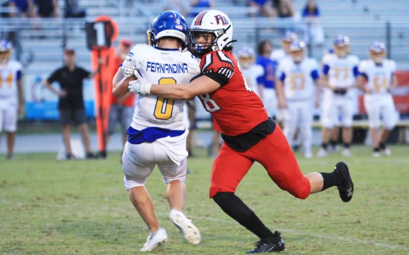 Fort White linebacker Teagin Beil makes a tackle against Fernandina Beach last Friday. (PAUL BUCHANAN/Lake City Reporter)