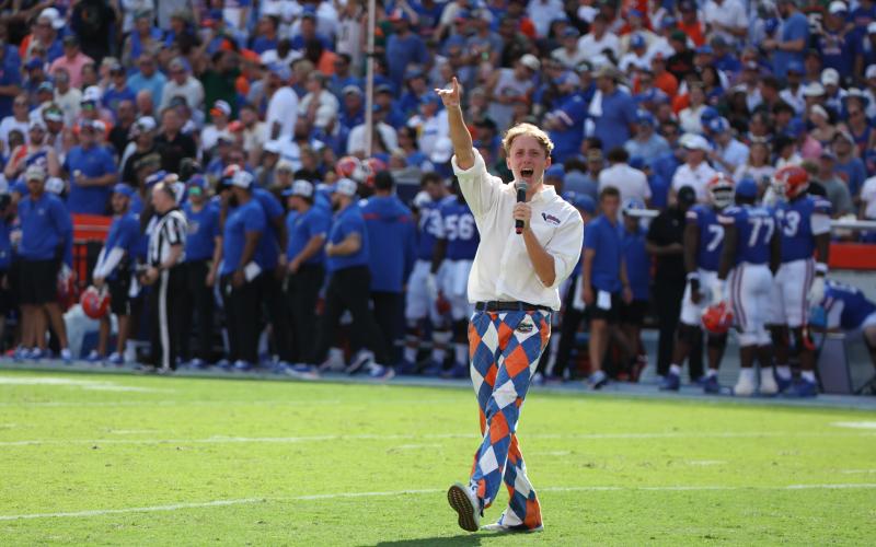 University of Florida sophomore Drew Hingson, 19, of Lake City, leads 90,000 fans in a cheer during the Gators home opener Saturday against Miami in The Swamp. Hingson is the school’s Florida Mic Man this season. Hingson will lead the crowd in pregame cheers of ‘Orange and Blue’ and the ‘Gators Spell-out’ and serve as the hype man with the Gators Cheer Squad in front of the student section at home football games. (COURTESY)
