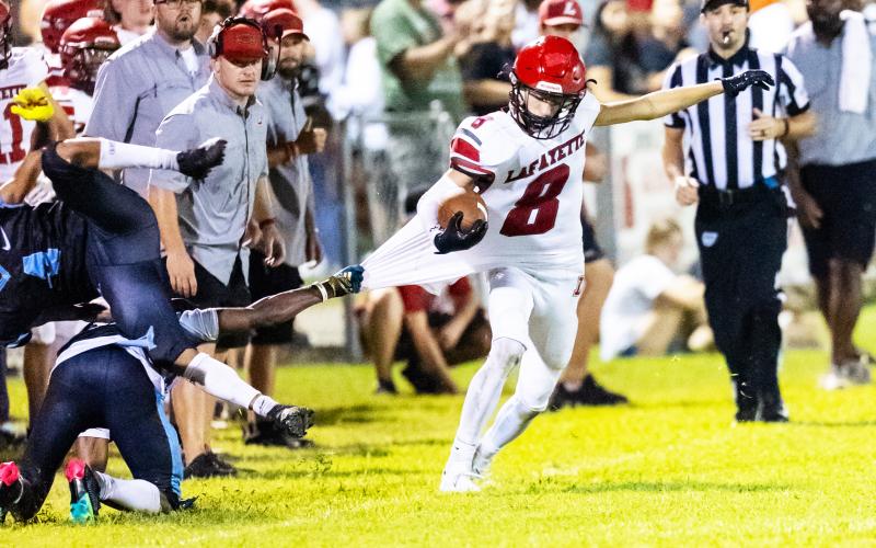 Lafayette receiver Parker Hill tries to escape a tackle from a Zarephath Academy defender on Friday. (JACK HOWDESHELL/Lake City Reporter)