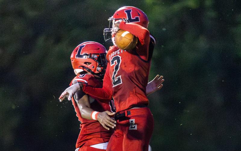 Lafayette receiver Jordan Murphy (2) celebrates with quarterback Tywan Williamson (9) after they connected for a touchdown against Brookwood on Friday. (JACK HOWDESHELL/Lake City Reporter)