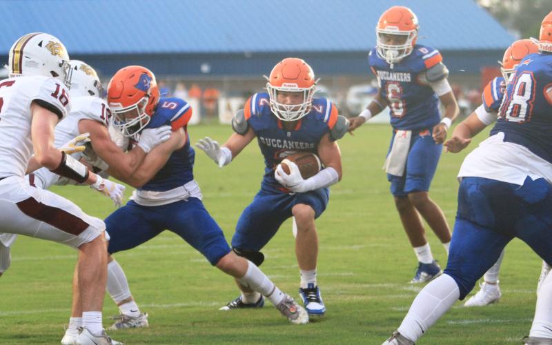 Branford running back Trevor Maddox hits the hole against Oak Hall on Aug. 23. (PAUL BUCHANAN/Lake City Reporter)