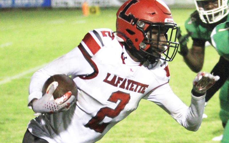 Lafayette receiver Jordan Murphy runs up the field after a catch against Suwannee last Friday. (PAUL BUCHANAN/Special to the Reporter)