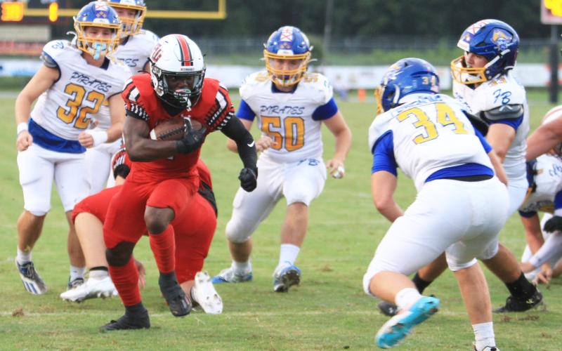 Fort White running back Keimarion Neal runs for a touchdown against Fernandina Beach on Friday. (PAUL BUCHANAN/Lake City Reporter)