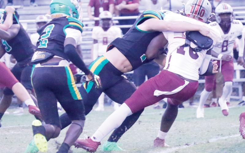 Suwannee linebacker Jace Moran tackles Madison County’s De’Andre Arnold last Friday night. (JAMIE WACHTER/Lake City Reporter)