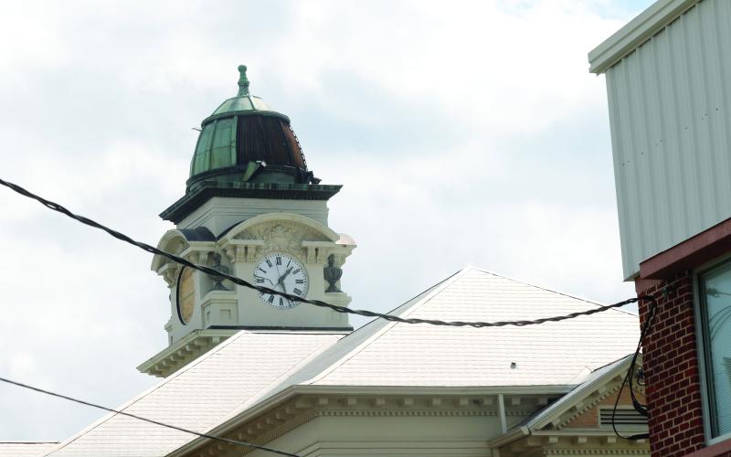 The copper dome on the Suwannee County Courthouse was peeled off during Hurricane Helene. Additionally two of the four clock faces on the courthouse clock tower were blown out during the storm. (JAMIE WACHTER/Lake City Reporter)