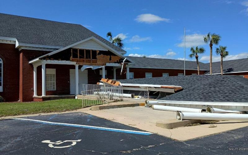 The awning over the drive-through drop-off entrance to Westwood Baptist Church in Live Oak collapsed during Hurricane Helene. (ROB WOLFE/Lake City Reporter)