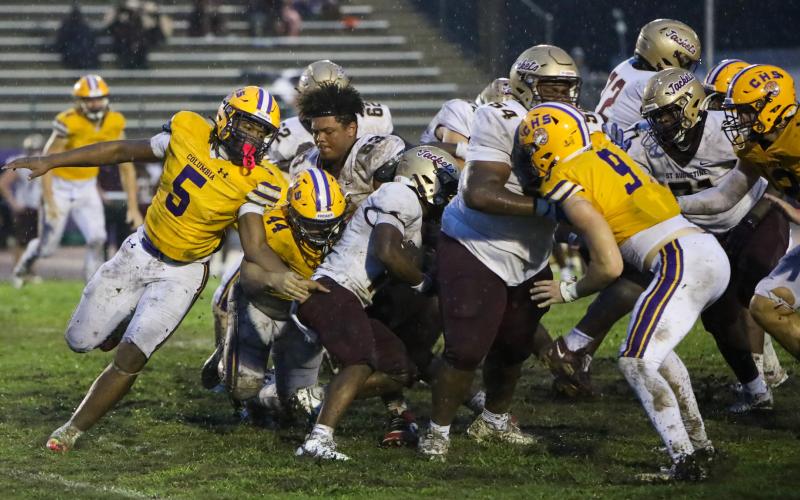Columbia defensive tackle Caden Bolstein (44) and linebacker Jalen Gaskins (5) rush in for a tackle against St. Augustine on Sept. 25. (BRENT KUYKLENDALL/Lake City Reporter)
