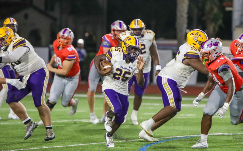 Columbia running back Jerome Horne runs for a big gain against Bolles on Friday. (BRENT KUYKENDALL/Lake City Reporter)