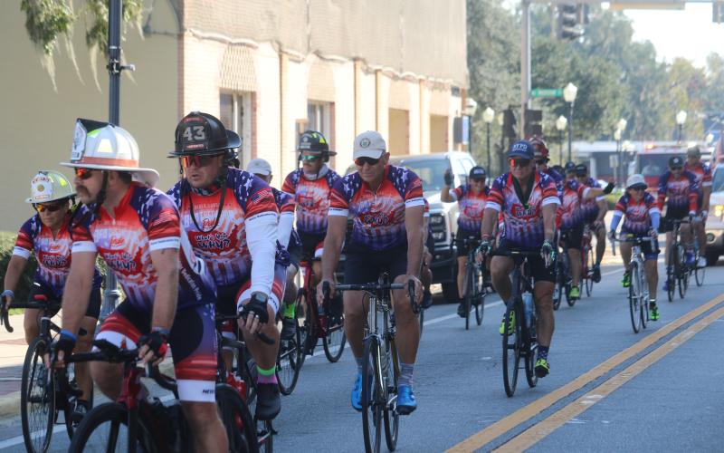 First Responders participating in the 2024 Brotherhood Ride, travel down Marion Avenue on their way to Lake City Elks Lodge #893 on Monday. (TONY BRITT/Lake City Reporter)