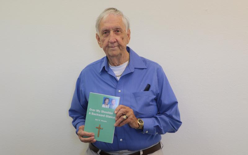 Bert Brooks’ latest book, ‘Over My Shoulder A Backward Glance,’ will be his final work. The 251-page book is Brooks’ observations over the years mixed with Biblical references tied to each story. (JAMIE WACHTER/Lake City Reporter)