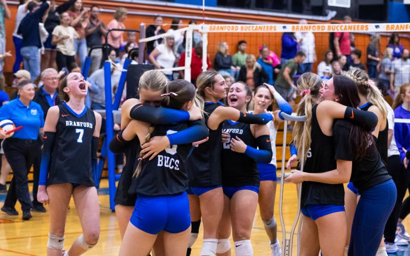 Branford celebrates after winning the fifth set to beat Union County in the Region 3-R championship on Tuesday. (JACK HOWDESHELL/Lake City Reporter)