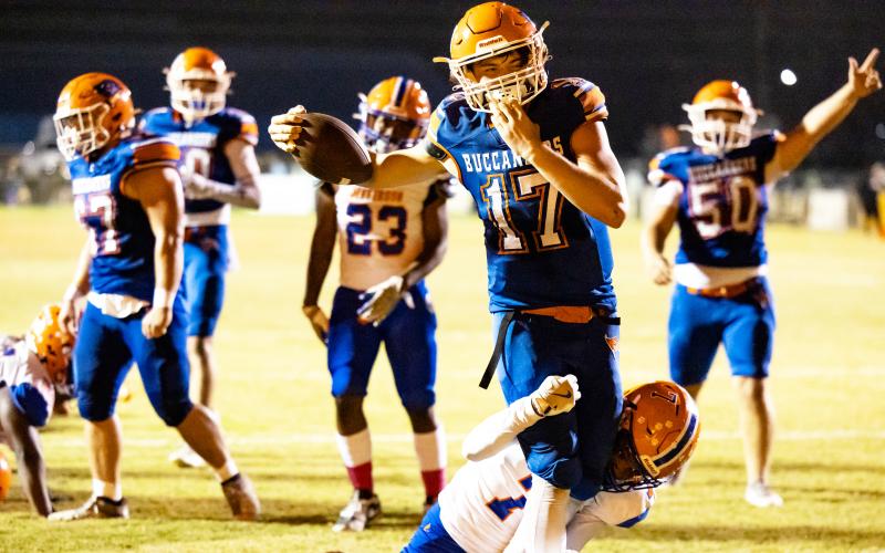 Branford quarterback Trent Land powers through a Jefferson County defender for a touchdown Friday. (JACK HOWDESHELL/Lake City Reporter)