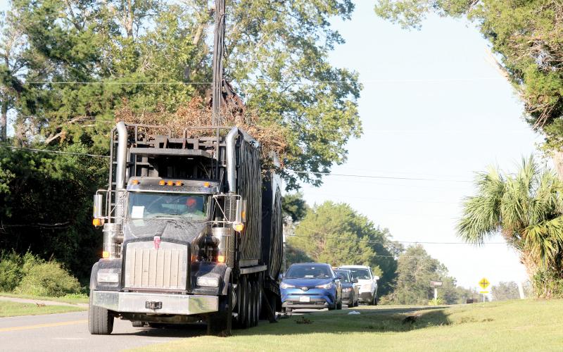 Columbia County crews and contractors are continuing to pick up debris from Hurricane Helene, already gathering as much as from Idalia a year ago. (JAMIE WACHTER/Lake City Reporter)
