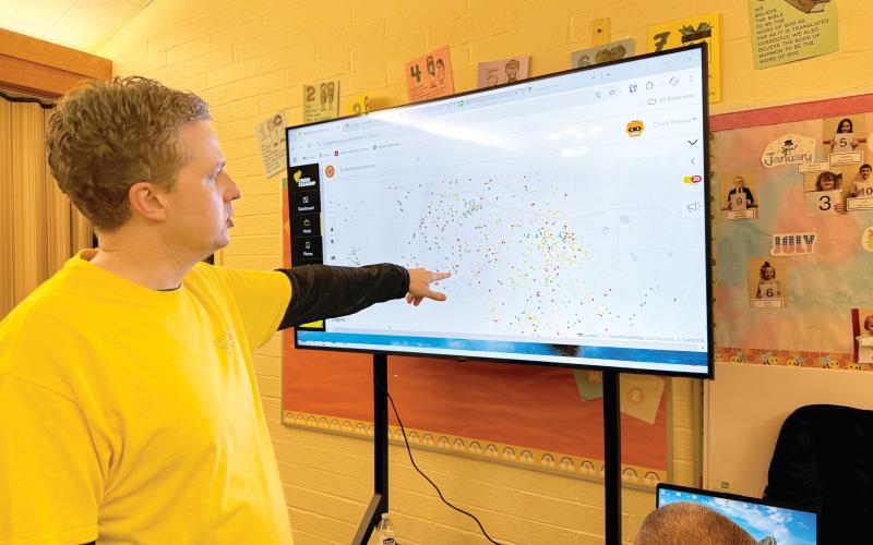 Andrew Miner, the president of the Cocoa Beach Stake of the Church of Jesus Christ of Latter-day Saints, looks at a map of the cleanup work needed in North Florida following Hurricane Helene. (JAMIE WACHTER/Lake City Reporter)