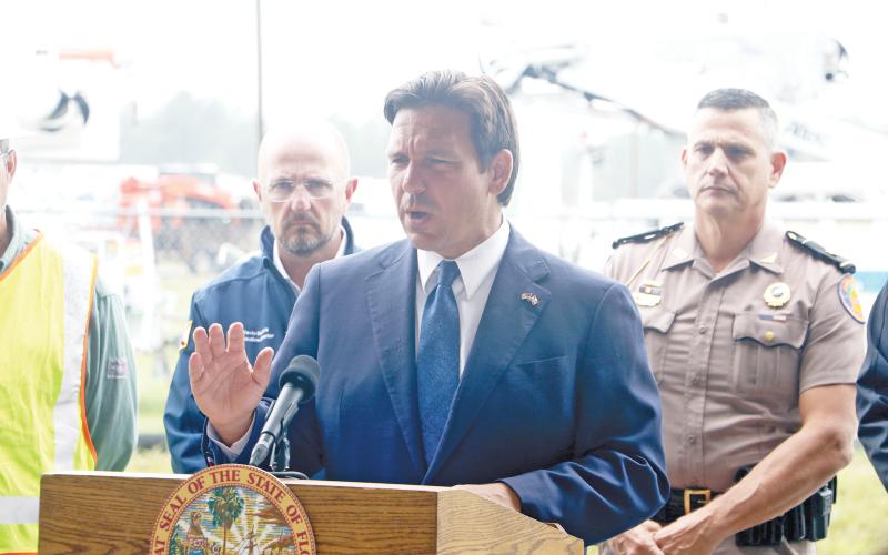 Gov. Ron DeSantis gives an update on Hurricane Milton from the Florida Gateway Fairgrounds on Wednesday afternoon. DeSantis said the state government is undertaking a “massive” response to Milton’s arrival. (MORGAN MCMULLEN/Lake City Reporter)