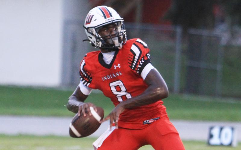 Fort White quarterback Jayden Jackson winds up to pass against Fernandina Beach on Sept. 13. (PAUL BUCHANAN/Lake City Reporter)