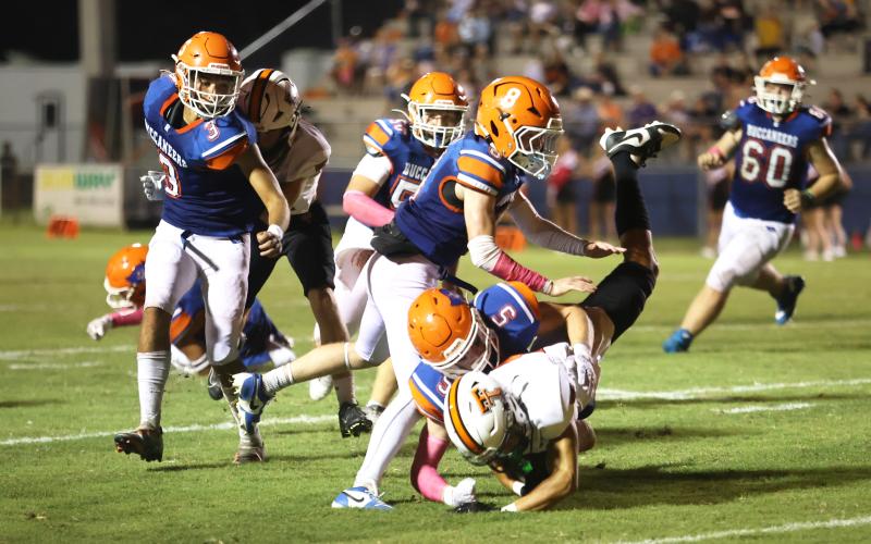 Branford’s Dawson Cannon (5) makes a tackle against Trenton on Oct. 4. (PAUL BUCHANAN/Lake City Reporter)