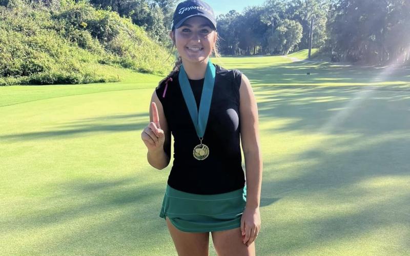Suwannee golfer Ryan Donaldson poses with her first-place medal after winning the Jill Darr Invitational on Thursday with a 10-under-62. (COURTESY)