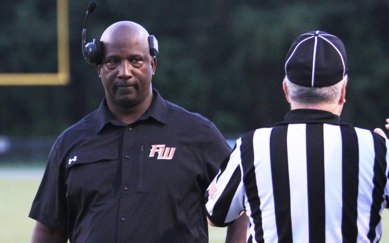 Fort White head coach Demetric Jackson stares at a referee during a game against Fernandina Beach on Sept. 13. (PAUL BUCHANAN/Lake City Reporter)