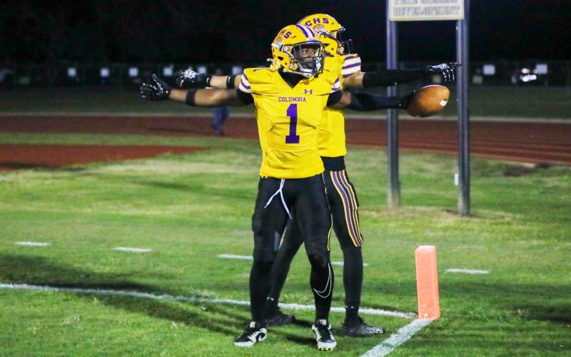 Columbia receiver Zamarion Jones (1) celebrates with receiver Bynton Edge in the end zone after scoring on a 4-yard touchdown run on 4th-and-goal against Ridgeview on Friday. (BRENT KUYKENDALL/Lake City Reporter)