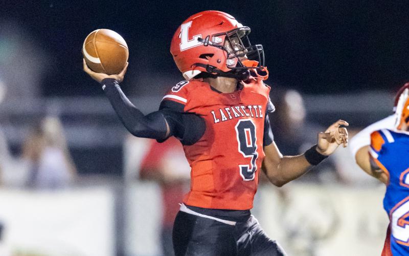 Lafayette quarterback Tywan Williamson throws a pass against Branford on Oct. 14. (JACK HOWDESHELL/Lake City Reporter)