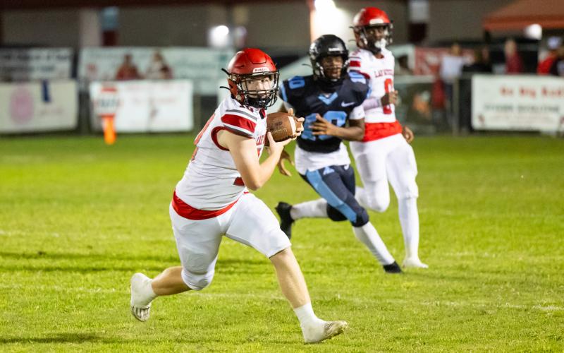 Lafayette receiver Tucker Higginbothom turns up field after catching a pass against Zarephath Academy on Sept. 20. (JACK HOWDESHELL/Lake City Reporter)