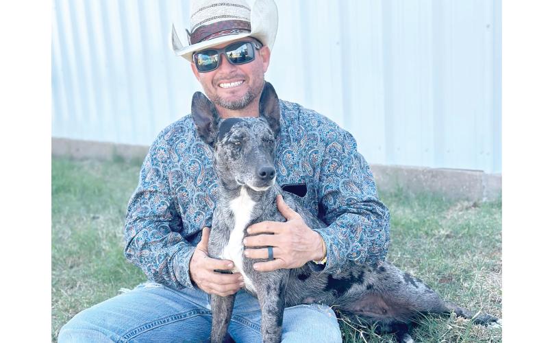 Jared Lee, a Live Oak cowboy, is pictured with Rainbow, his world champion cowdog. Rainbow won her third straight world title this past weekend at the Hangin’ Tree Cowdog Association world championships in Texas. (COURTESY)