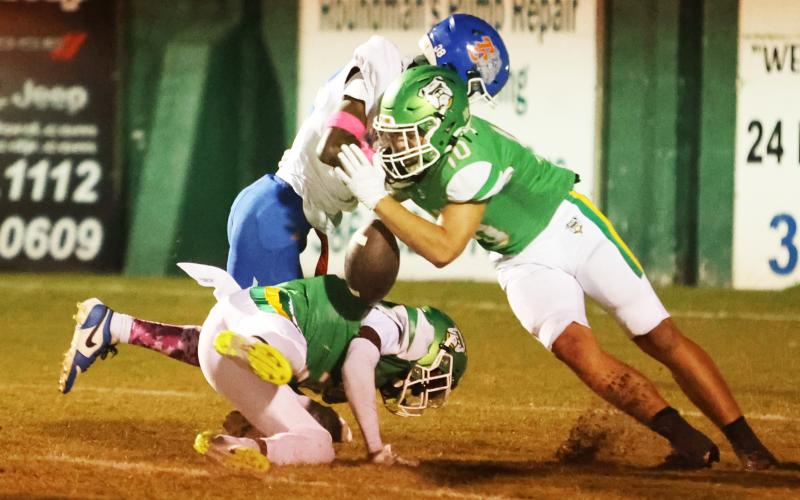 Suwannee safety Koy Frier forces a fumble with a big hit on Taylor County receiver James Mingo on Friday. (PAUL BUCHANAN/Lake City Reporter)