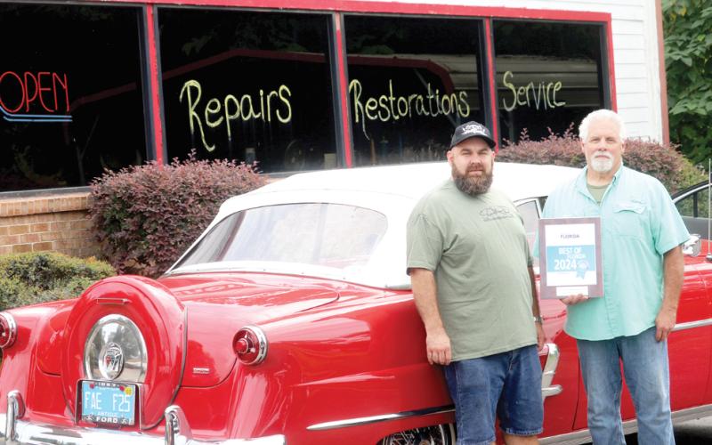 Sherm’s Auto Repair and Restoration was nominated previously for the Guide to Florida Best of Florida award for best auto repair center, but this year’s award was the first time it has captured the honor. Sherman Stanley, the repair shop owner, pictured with his son, Tre’s Stanley, said it is big recognition. (TONY BRITT/Lake City Reporter)