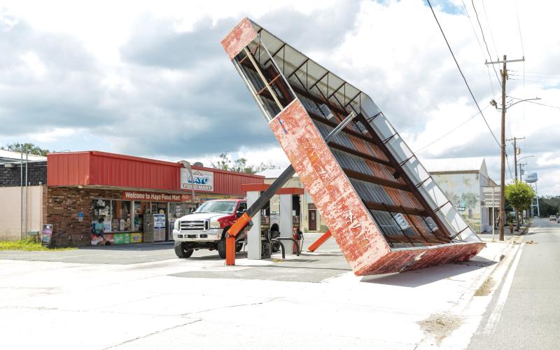 The canopy over the gas pumps at the Mayo Food Mart on W. Main Street was toppled by the winds during Hurricane Helene. (JACK HOWDESHELL/Lake City Reporter)